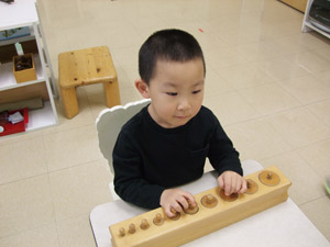 Child playing during Educational playtime in Rochester, NY at Greece Montessori School